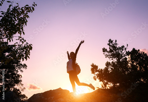 Silhouette of a happy young...