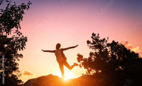 Silhouette of a happy young...