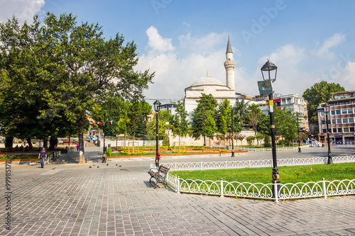 ISTANBUL - AUGUST 18: Sultanahmet Square on August 18, 2015 in Istanbul. Sultanahmet Square is historic district of Istanbul near the Blue Mosque, it is a popular area among tourists photo
