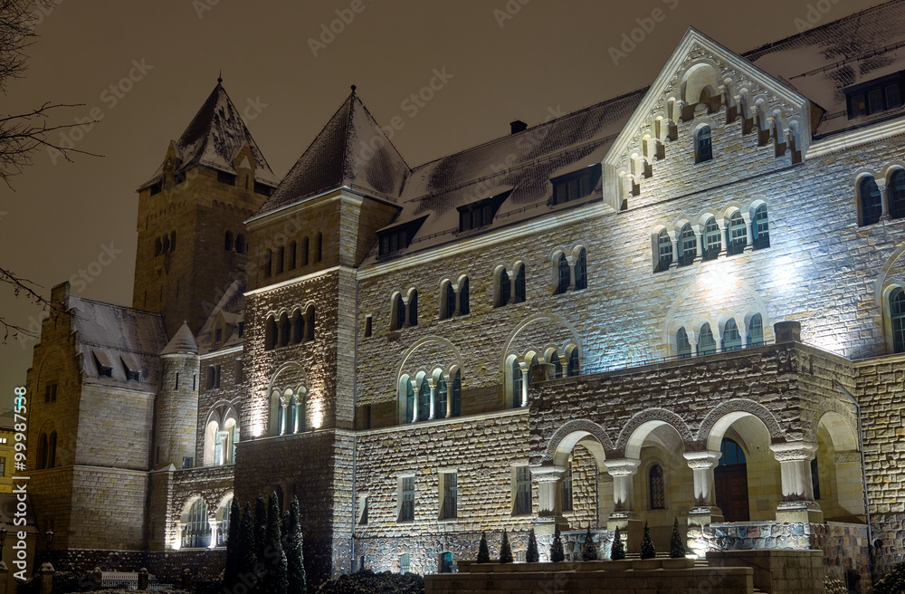 The Neo-Romanesque building of the Imperial Castle at night in Poznan.