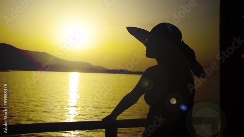 SUMMER CONCEPT, silhouette girl with hat  photo