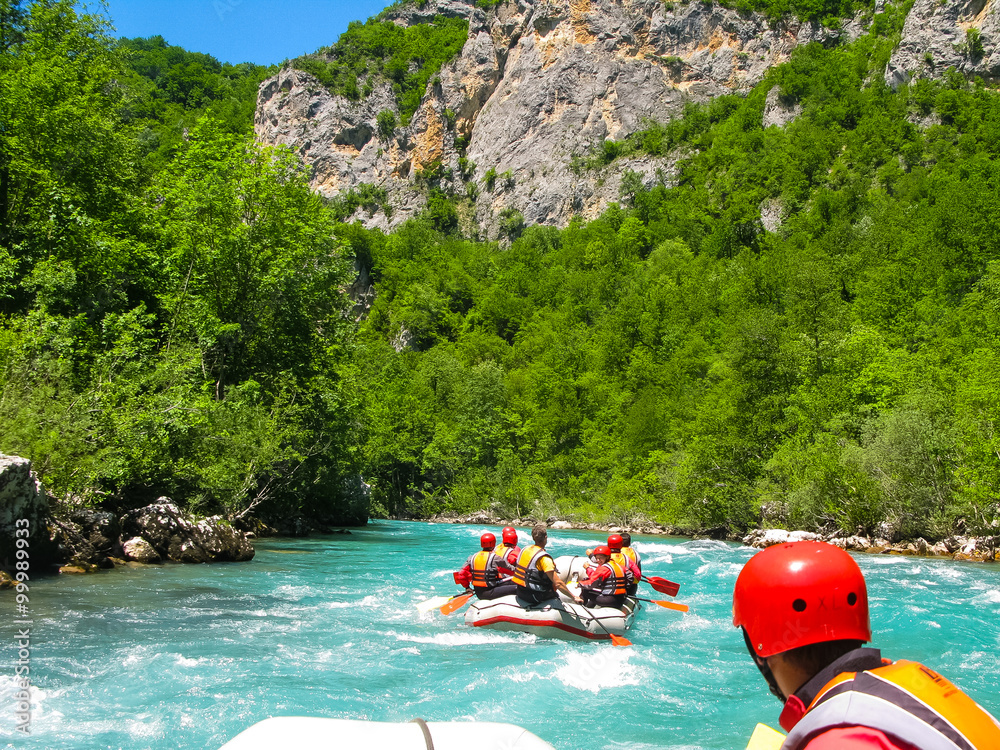 rafting boat on the fast mountain river - obrazy, fototapety, plakaty 