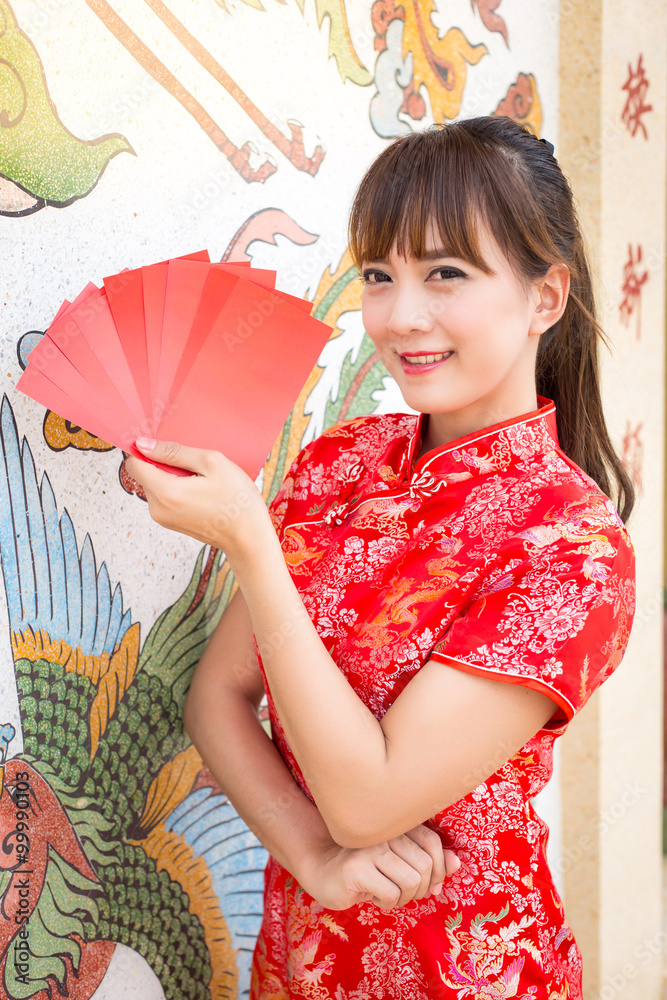 Φωτογραφία Happy chinese new year,Cute smiling Asian woman dress traditional cheongsam and