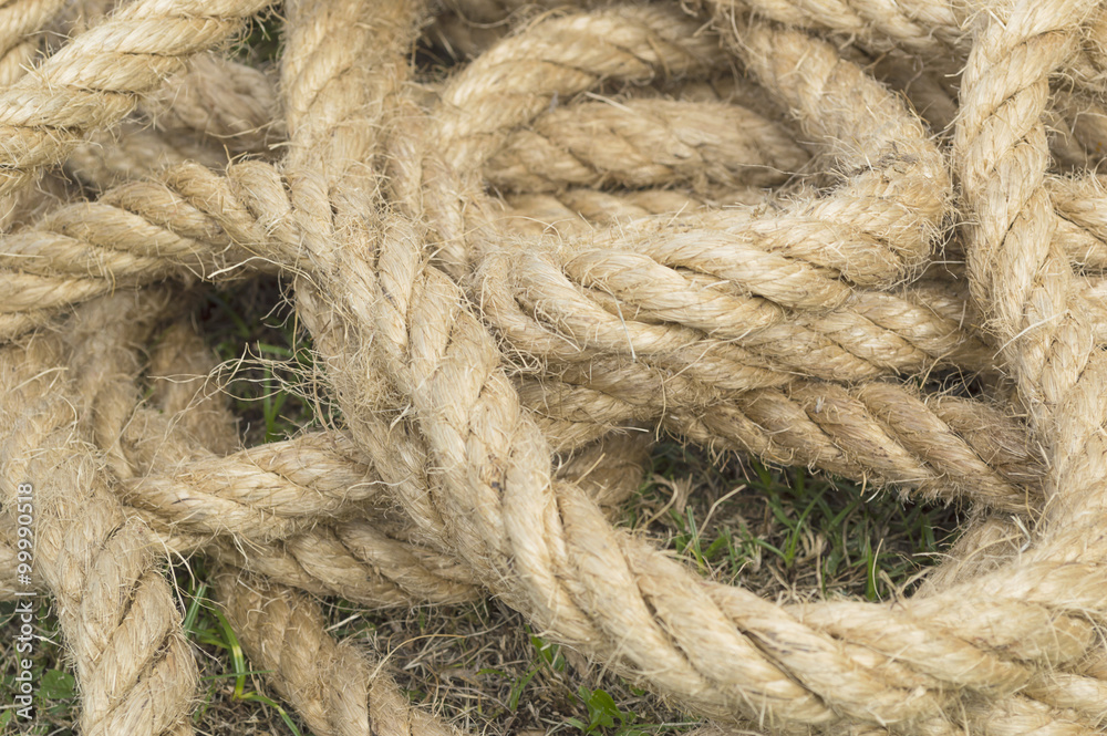 Close-up of an old  rope as a grass background, hemp rope
