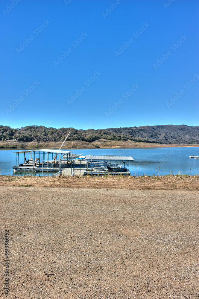 Lake Casitas boats with low water line in background.