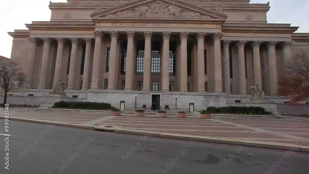 Dolly shot of the National Archives Building at the North side of Pennsylvania Ave. with lens flare Dolly shot of the National Archives Building at the North side of Pennsylvania Ave. with lens flare