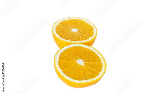 Orange halves arranged on white background.