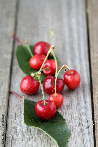 Close up of red Cherries on wooden board