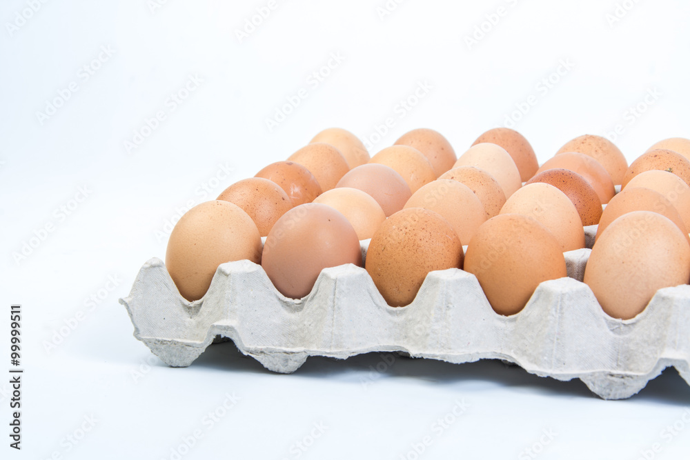 Egg in an egg crate on white background Egg in an egg crate on white background
