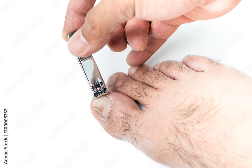 Hand man use a nail cliper to cut toenail