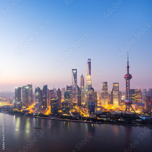 waterfront cityscape in blue sky at dawn