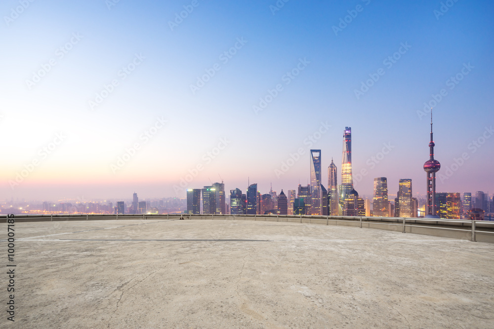 empty floor and cityscape in blue sky