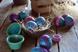 Easter egg painted with bright colors and glitter.