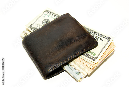 Old wallet with banknotes of US dollars inside