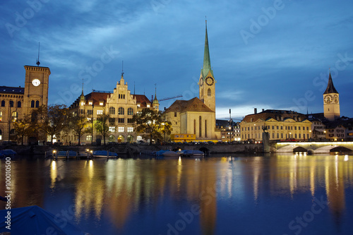 Night panoramic photo of city of Zurich and reflection in Limmat River  Switzerland
