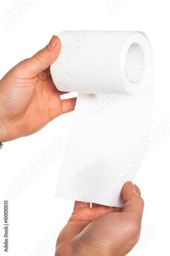 Hand holding toilet paper roll