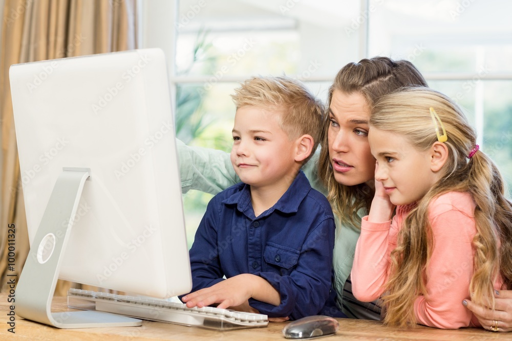 Happy family using the computer