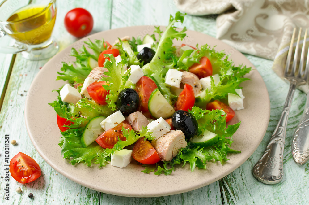 Fresh salad with tuna, tomatoes and cucumbers