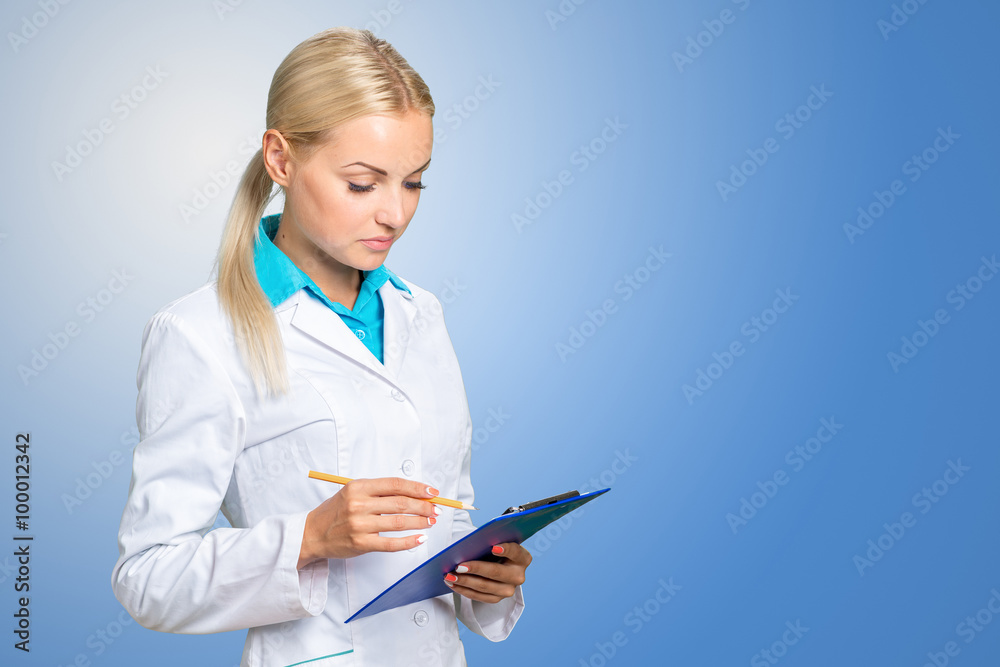Portrait of happy female doctor holding blank paper on clipboard Portrait of happy female doctor holding blank paper on clipboard