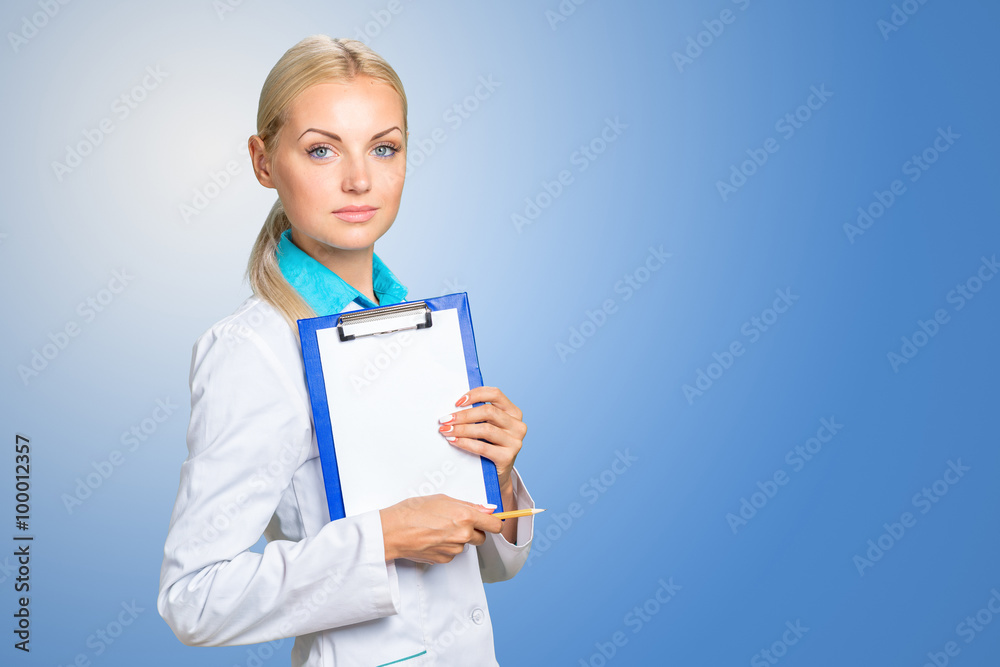 Portrait of happy female doctor holding blank paper on clipboard Portrait of happy female doctor holding blank paper on clipboard