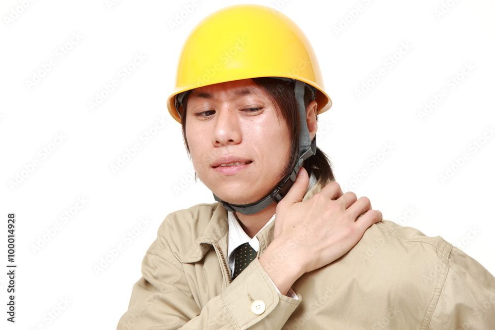 Japanese construction worker suffers from neck ache Japanese construction worker suffers from neck ache