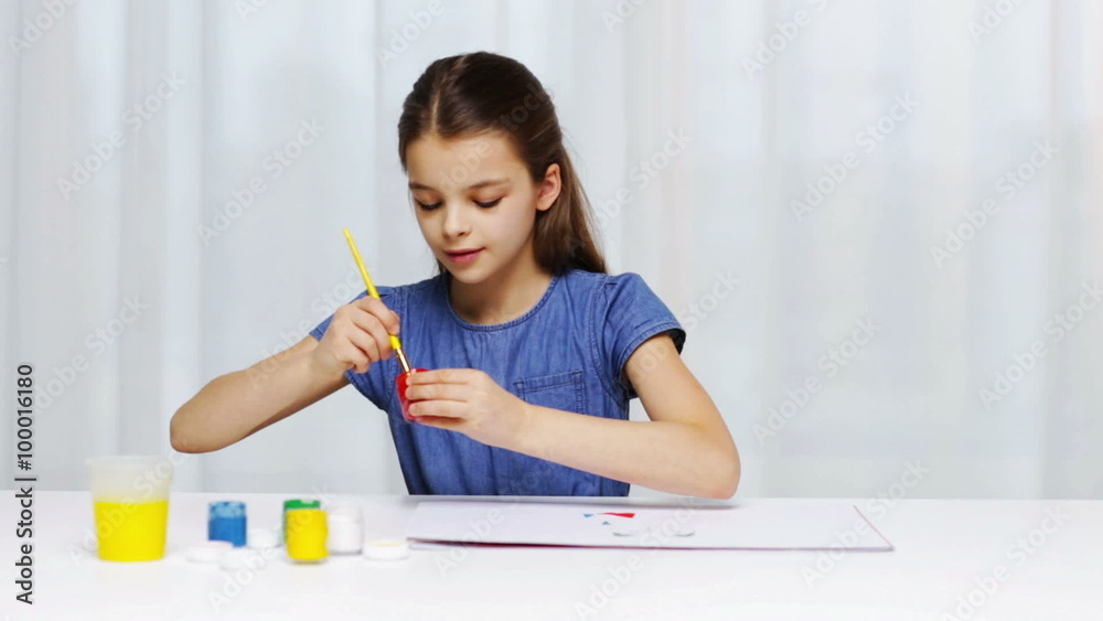 happy girl painting with gouache colour at home happy girl painting with gouache colour at home