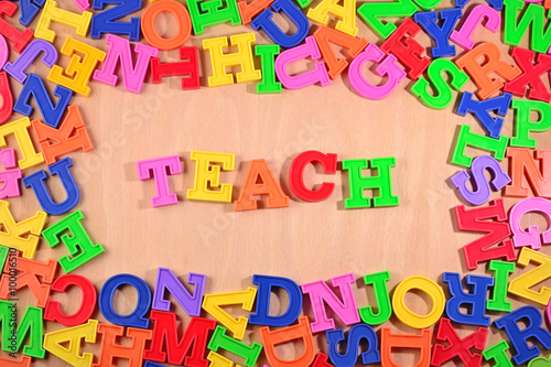Teach written by plastic colorful letters