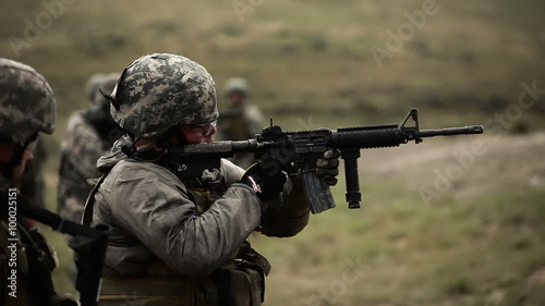 Soldier shooting an M4 rifle