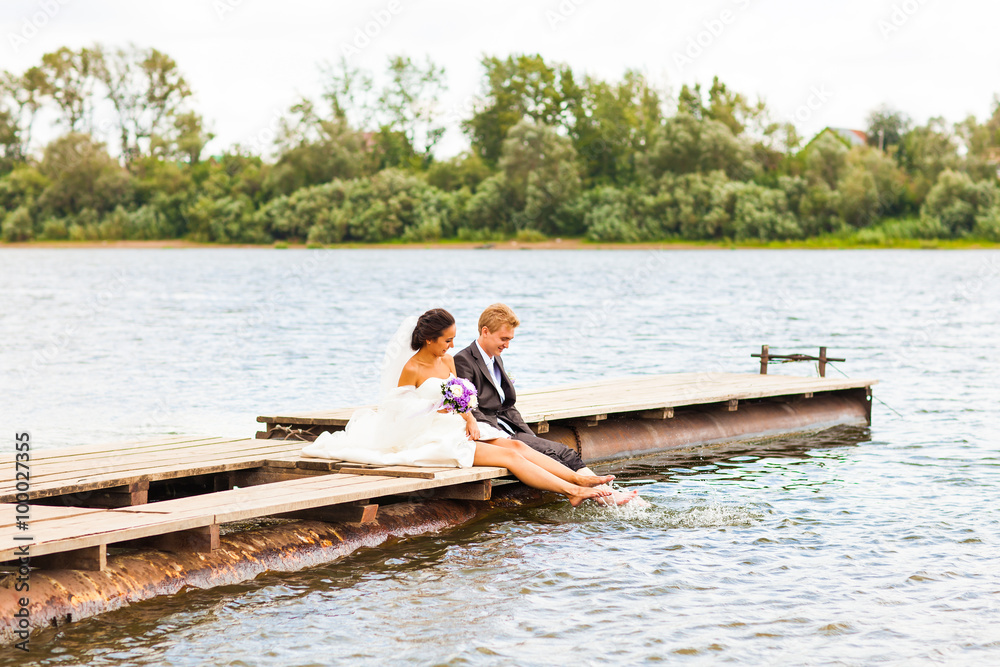 wedding couple on the pier near big lake wedding couple on the pier near big lake