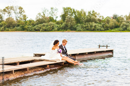  wedding couple on the pier near big lake