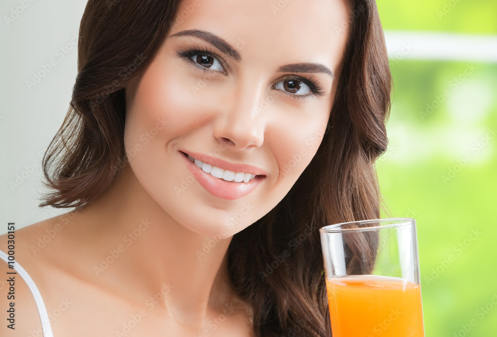 Happy smiling young woman drinking orange juice Happy smiling young woman drinking orange juice