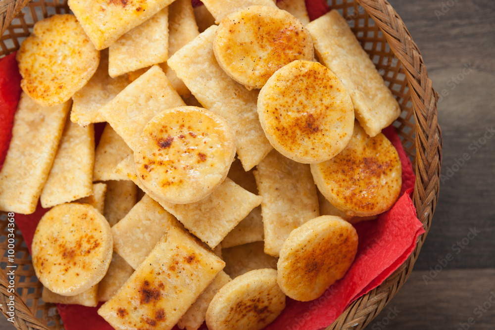 Homemade salty crackers with red paprika on top Homemade salty crackers with red paprika on top