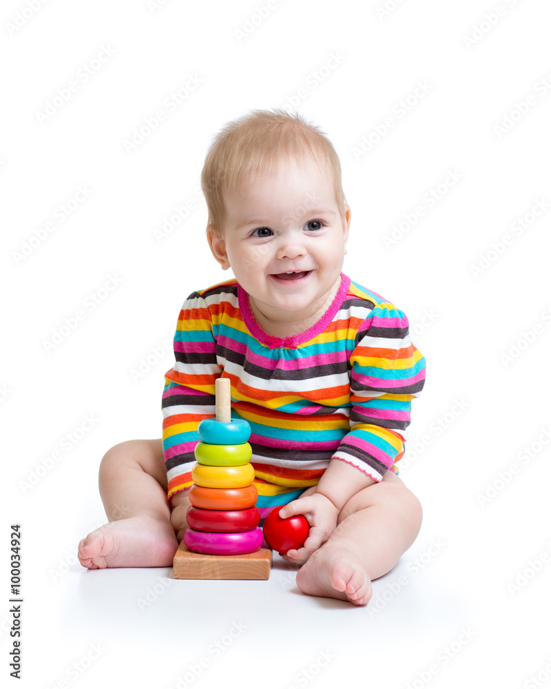 child playing with color pyramid toy child playing with color pyramid toy
