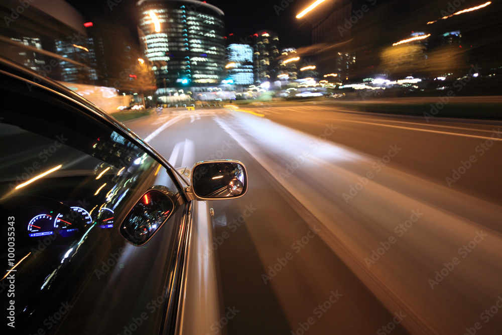 Night drive with car in motion.