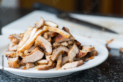 Chopped juicy grilled pork in kitchen scene