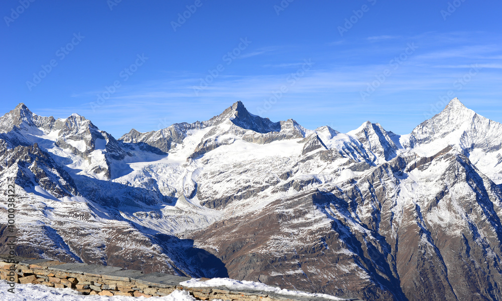 view of snow mountains on a clear sunny day from gornergrat, Swi