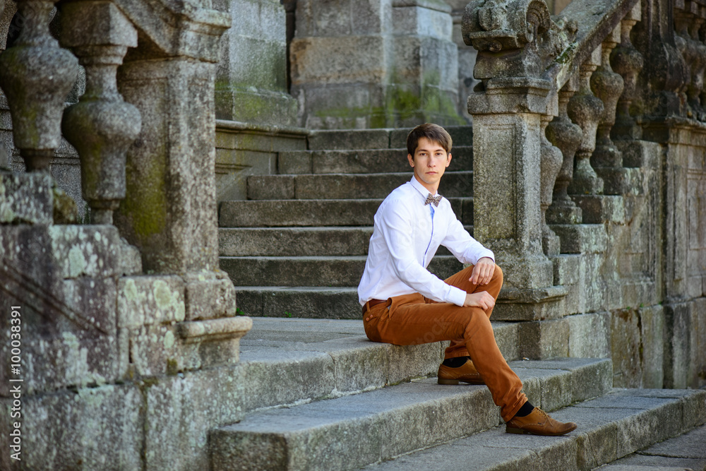 young cute guy sitting on the porch young cute guy sitting on the porch