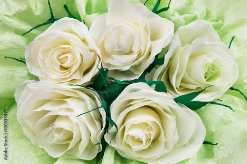 Paper white roses cloceup background