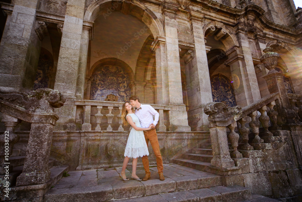 gentle happy stylish romantic couple on the background of  castle