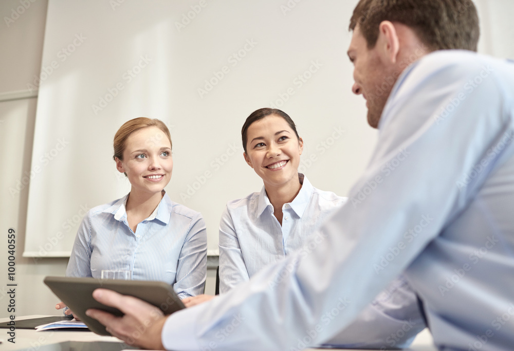 smiling businesspeople with tablet pc in office smiling businesspeople with tablet pc in office