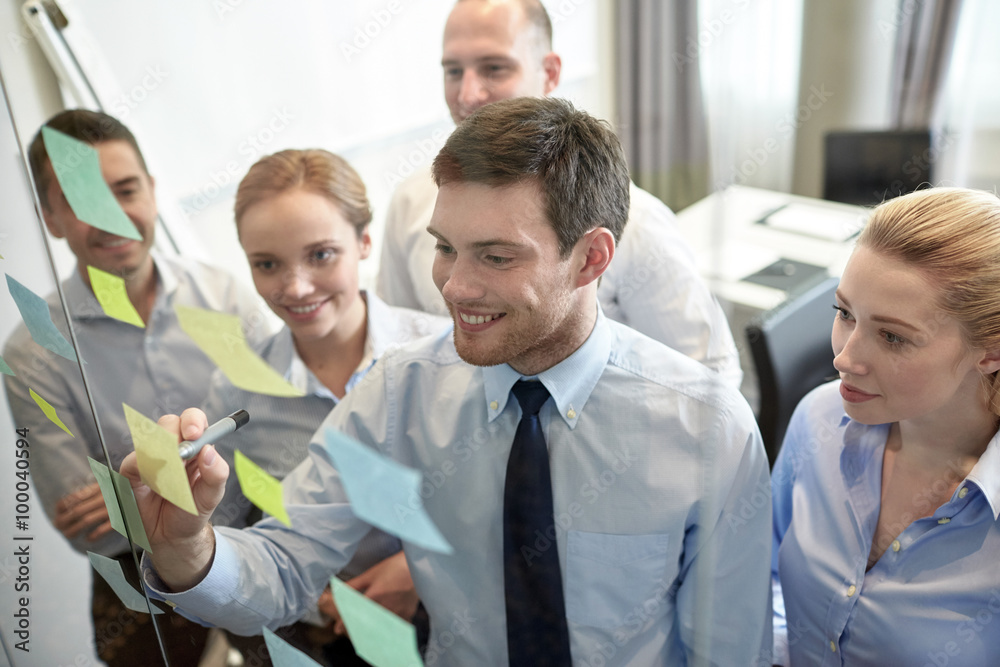 smiling business people with marker and stickers smiling business people with marker and stickers