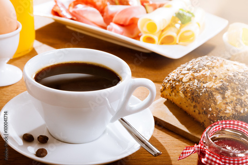 Coffee with bread and meat photo