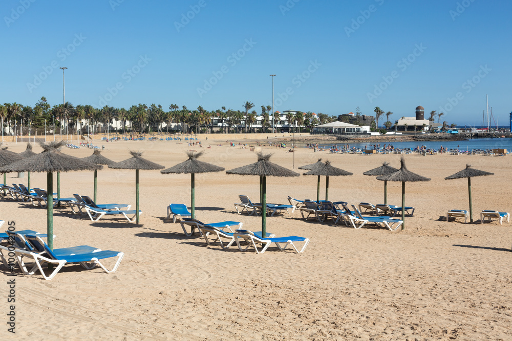 Sun lounger on the beach of Caleta de Fuste, Canary Island Fuerteventura, Spain