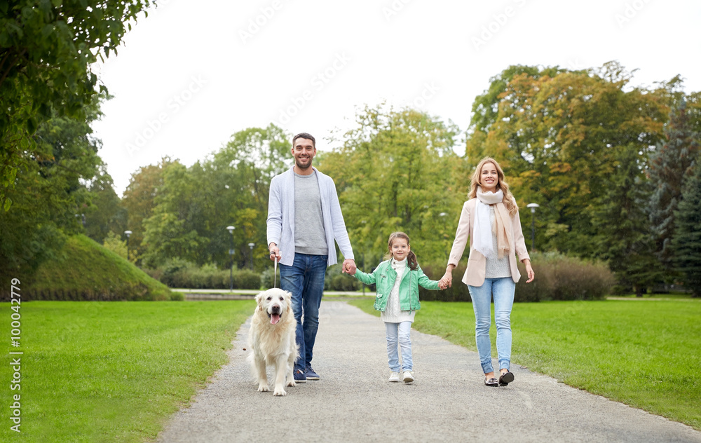 happy family with labrador retriever dog in park happy family with labrador retriever dog in park