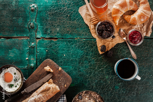 Breakfast spread with coffee, bread and preserves photo