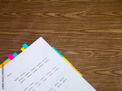 French; Learning New Language Writing Words on the Notebook