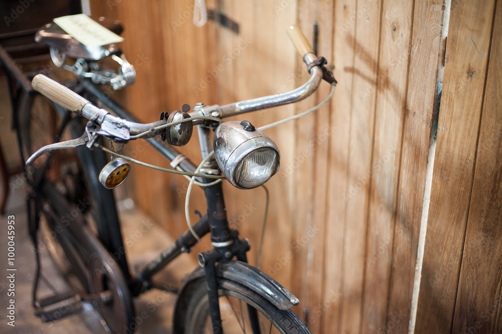 Old bicycle on wooden background