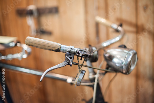 Old bicycle on wooden background