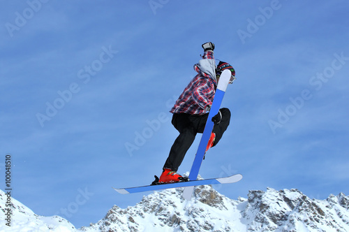 freerider touching his skis