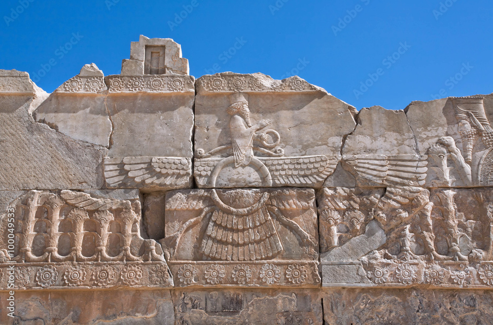 Wunschmotiv: Ahura Mazda - relief of winged sun symbol of Zoroastrianism in ruined Persepolis #10004